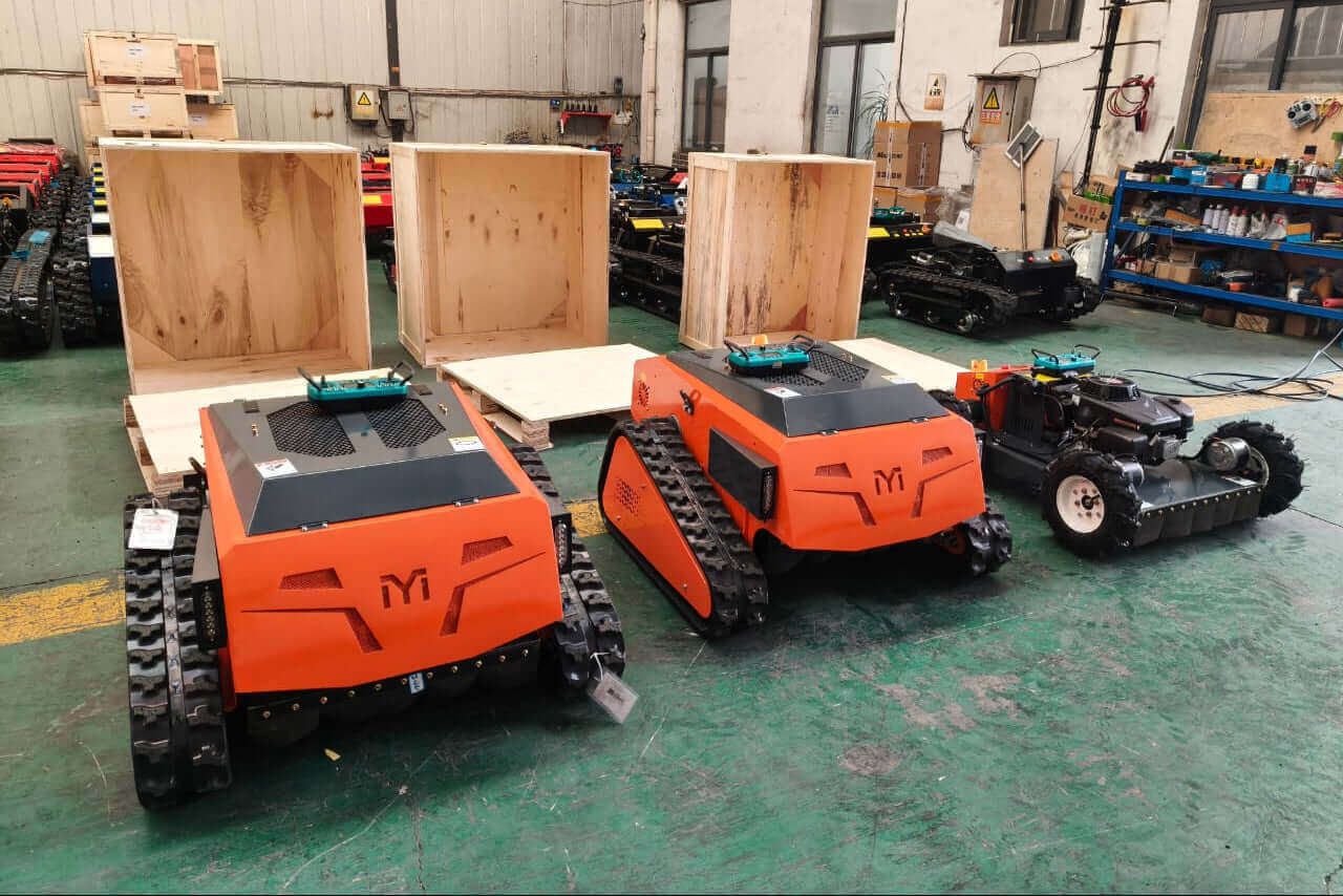 Remote control lawn mower models displayed in a workshop, showcasing their heavy-duty design and advanced features.