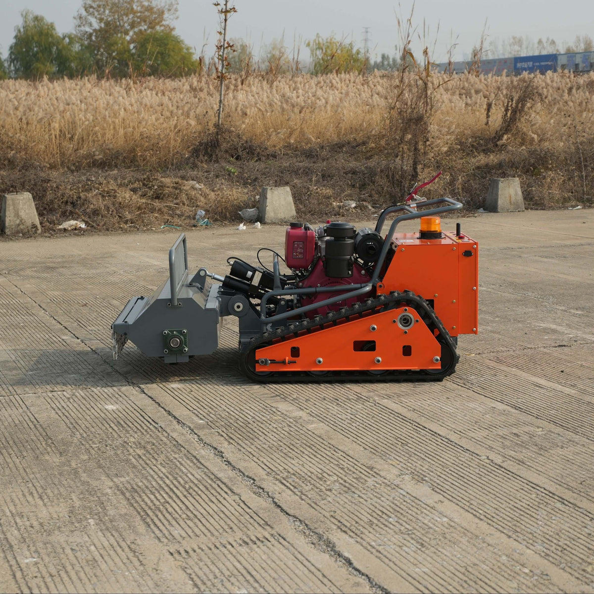Toro remote control lawn mower - HIPPO Flail 1000mm heavy-duty vegetation clearing machine on a worksite.