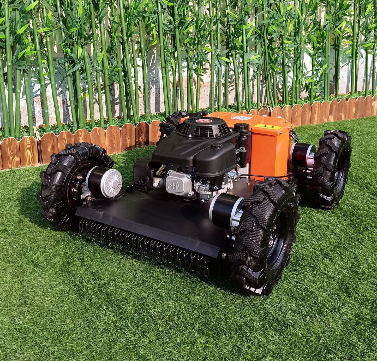 RC lawn mower on a grassy area with cornstalks in the background