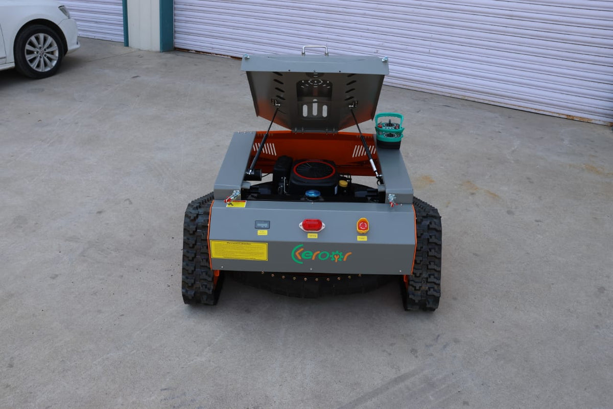 Redback remote control lawn mower showcasing its steel body design and engine compartment, ready for lawn care.