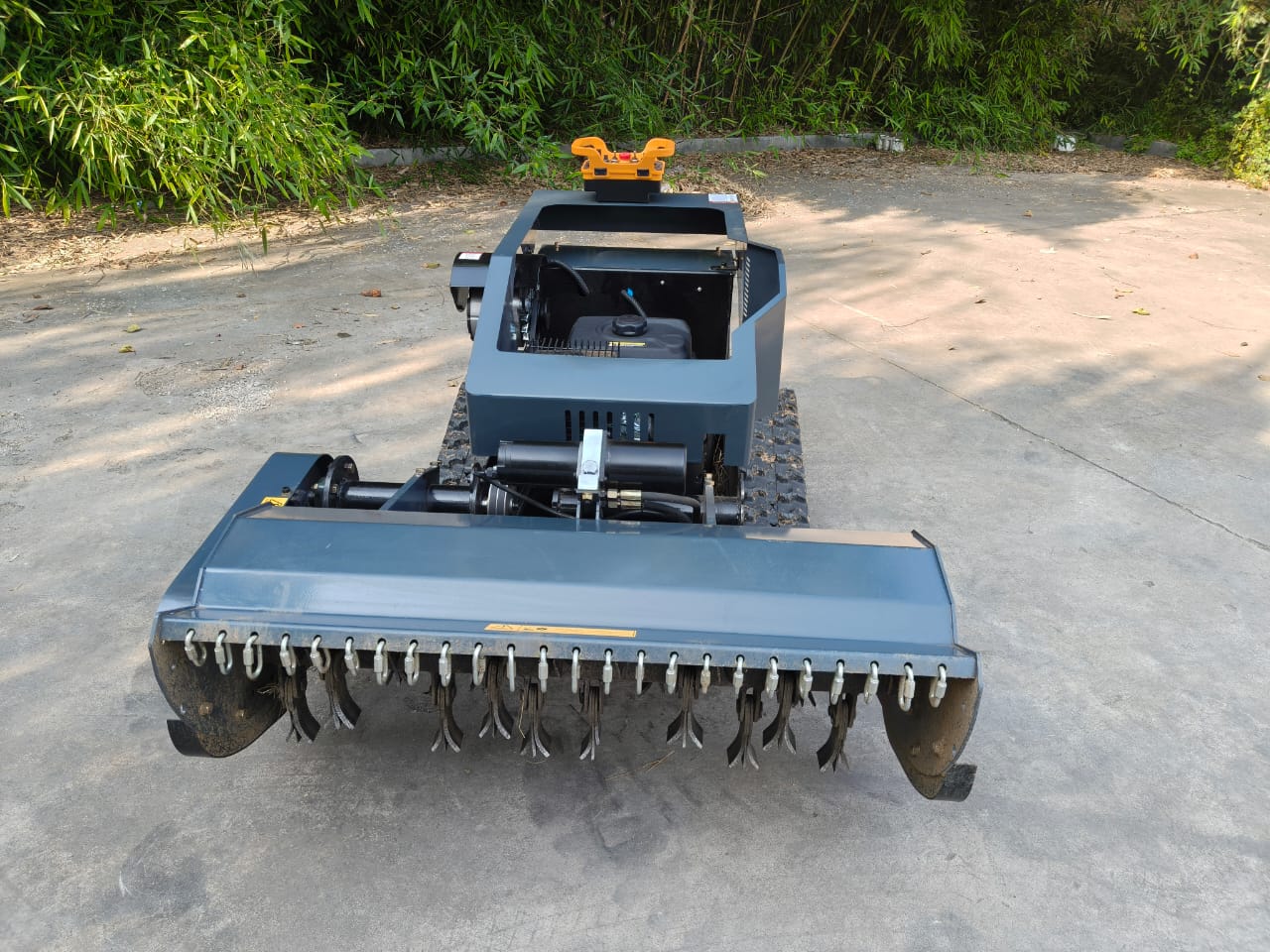 Garden remote control mower on a concrete surface