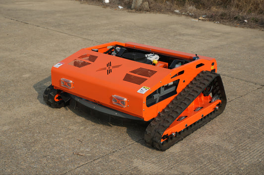 Low profile Big Bill Remote Control Lawn Mower from Rebel mowers. 45 degree climbing ability, 16 Hp 426 cc motor has sharp teeth, good table manners and eats whatever is put in front of it.