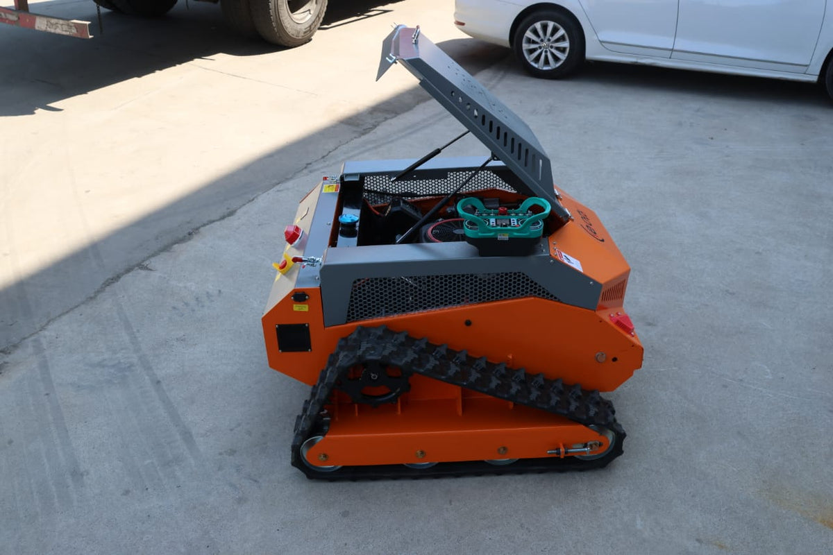 Redback remote control lawn mower showcasing its full steel body and tracked design for effortless yard maintenance.