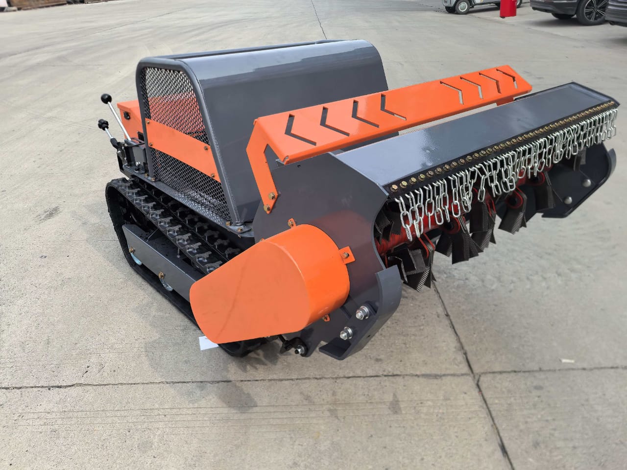 Remote Control Mower Big Boar 1200mm cut all terrain flail mower at full lift. The 400mm blade lift is amongst the highest of any machine in its class. As the blade lifts higher the guard retreats giving easy access for the spinning blades to chop recalcitrant vegetation. Regain your land and remove invasive weeds.