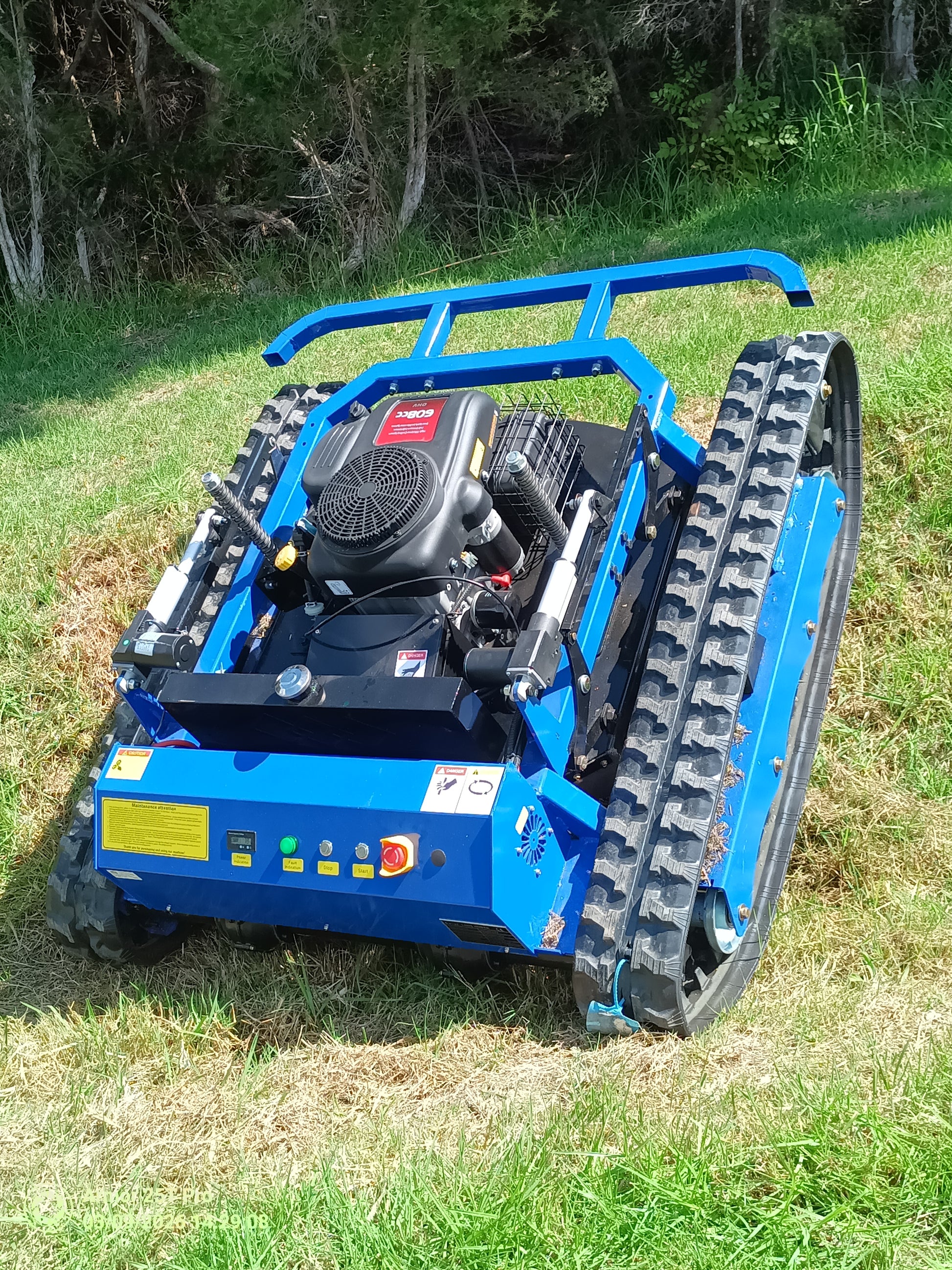 Remote control mower Australia Tank800. Our best hill climber. Low profile slips under trees and vines. Climbs up to 50 degrees, mows almost anything. 800mm cut, 22 Hp. 
www.rebelmowers.com.au