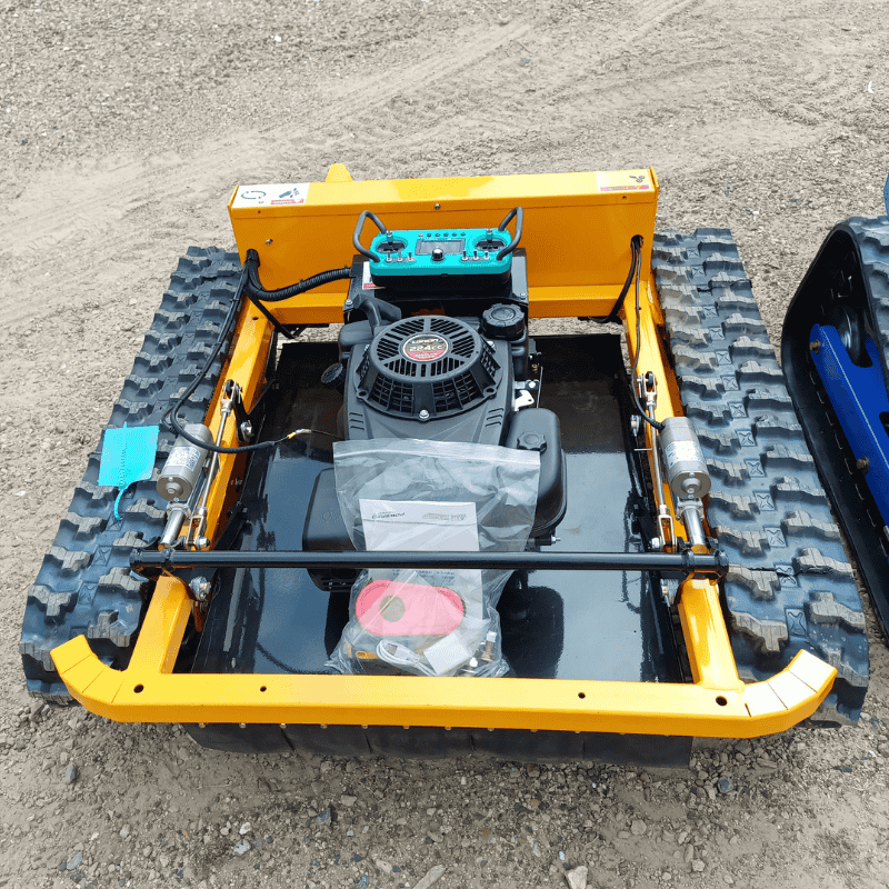 Overview of the remote control lawn mower Victoria showing its powerful engine and rugged tracks for extreme terrain mowing.
