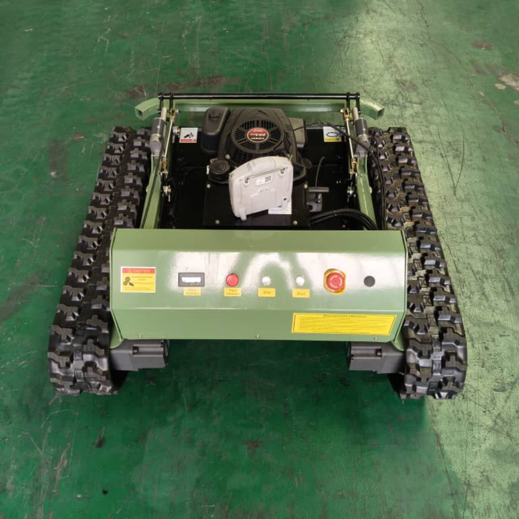 Radio controlled lawn mower with tracked drive system and remote control features for efficient terrain cutting.