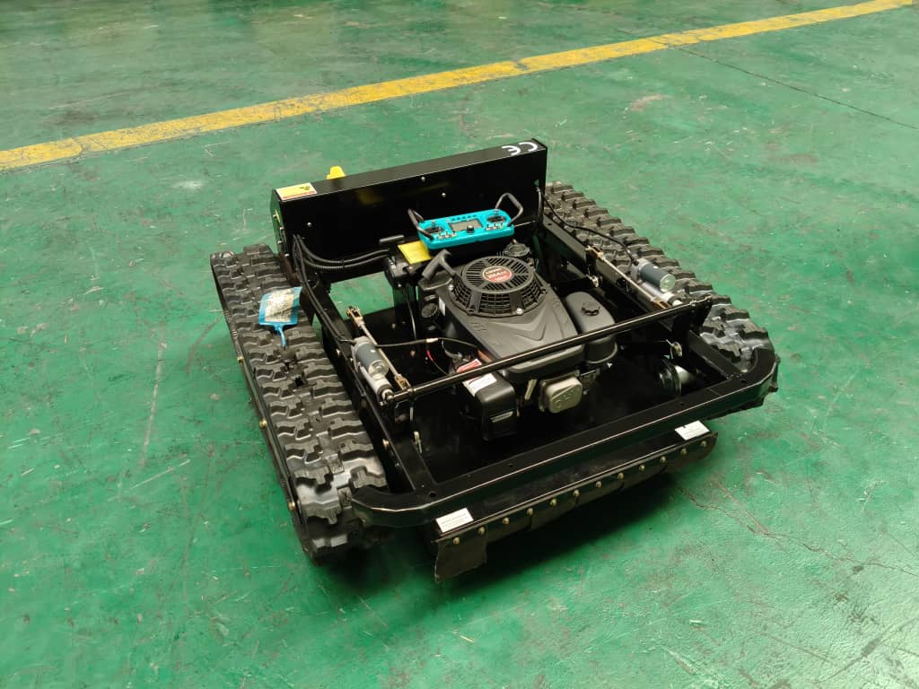 Radio controlled lawn mower with 9Hp engine and tracked drive system for extreme terrain cutting.