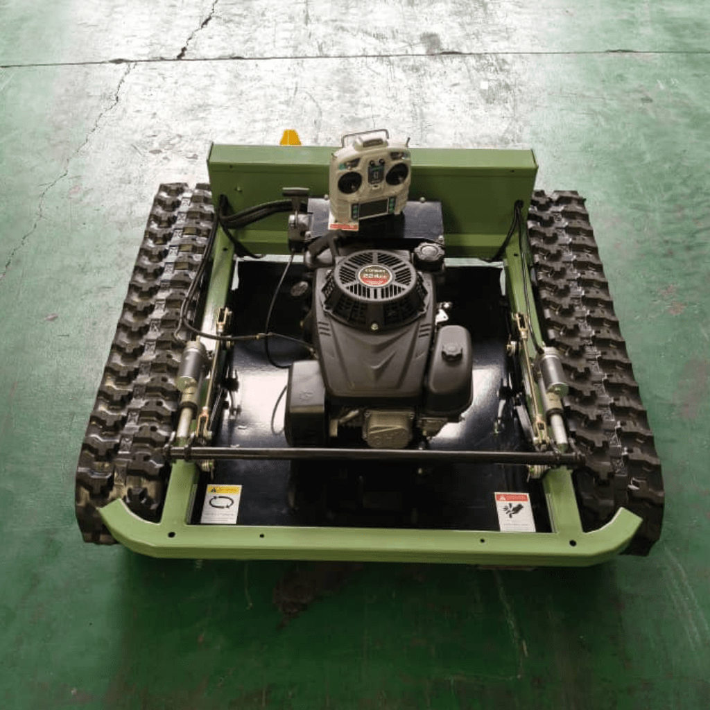Radio controlled lawn mower with remote control and powerful 9HP engine on a tracked drive system.