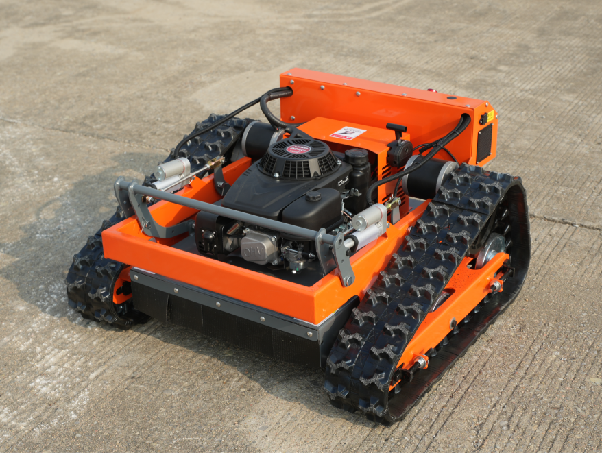 Orange tracked Typhoon RC mower www.rebelmowers.com.au
