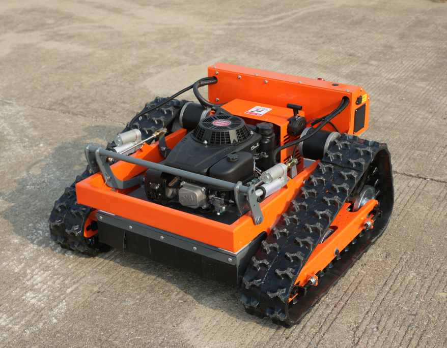 Orange tracked Typhoon RC mower www.rebelmowers.com.au
