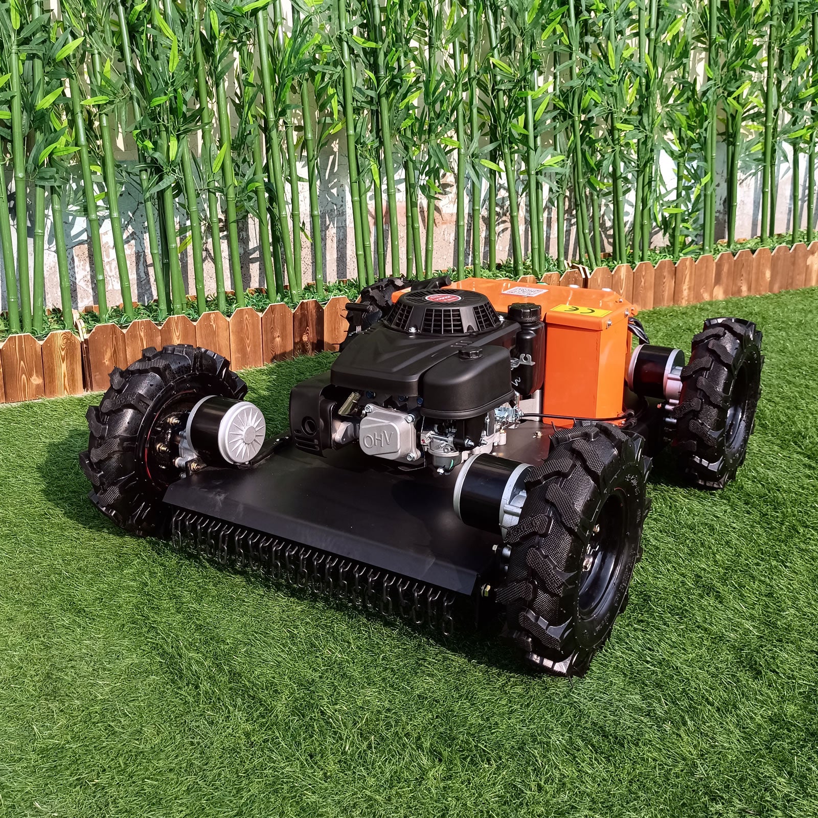 RC lawn mower on a grassy area with cornstalks in the background
