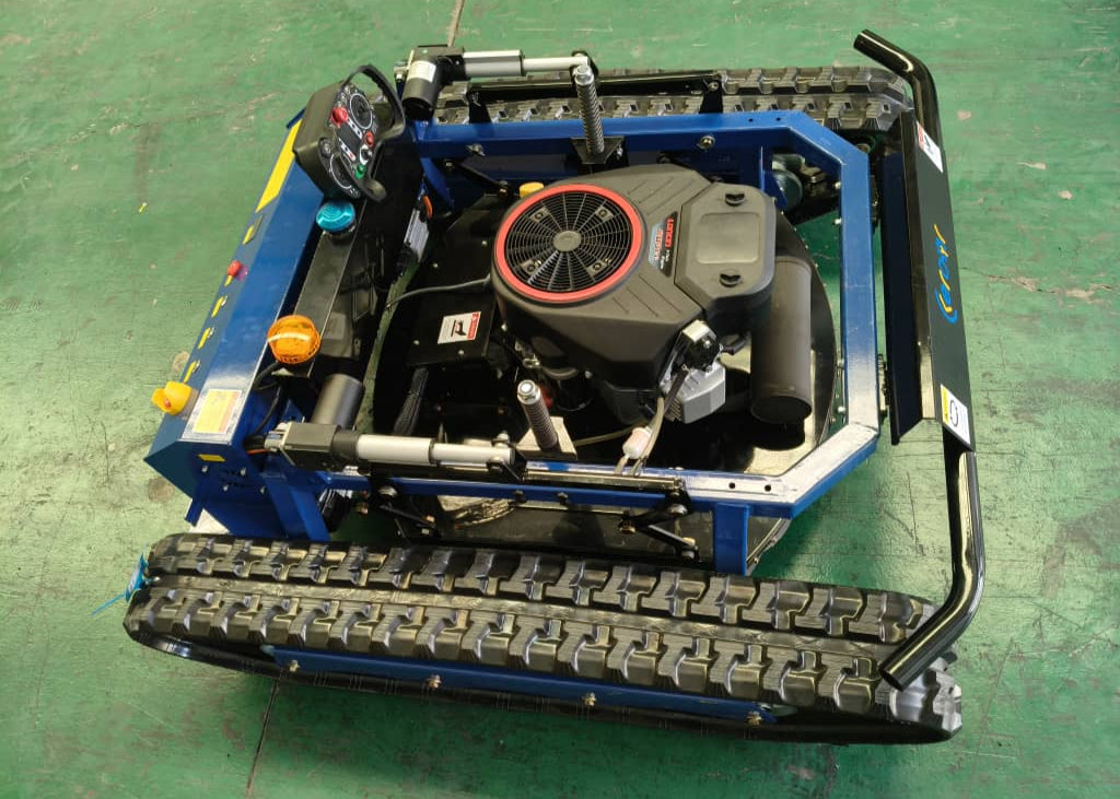 RC lawn mower on a green surface