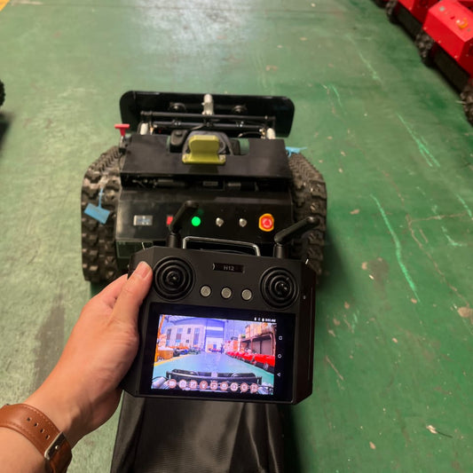 Colour video remote handset for beyond line of sight control of remote control mower