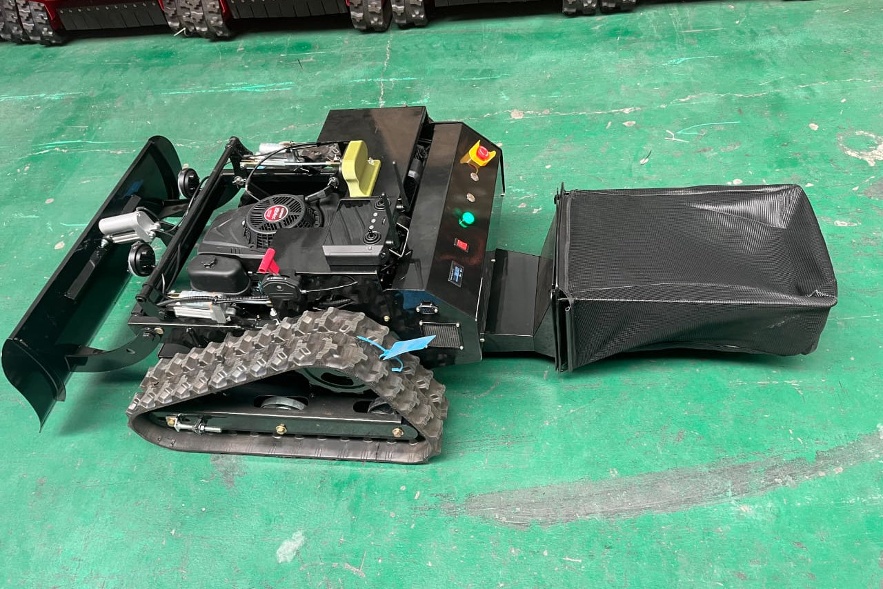 Remote control mower with video remote handset. Operate machine away from direct supervision.