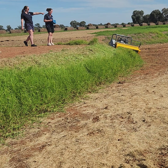Girls using remote control mower