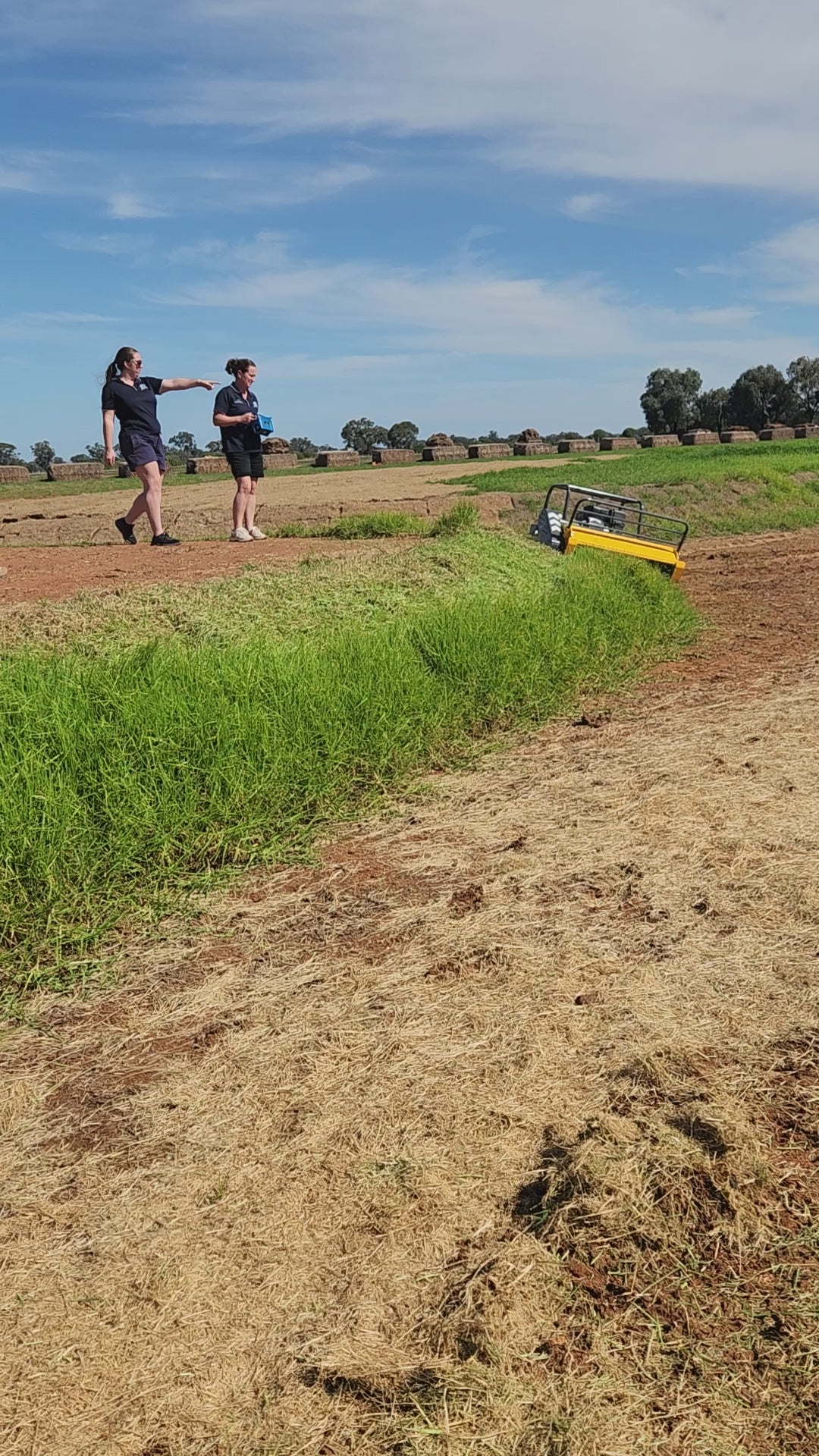 Girls using remote control mower