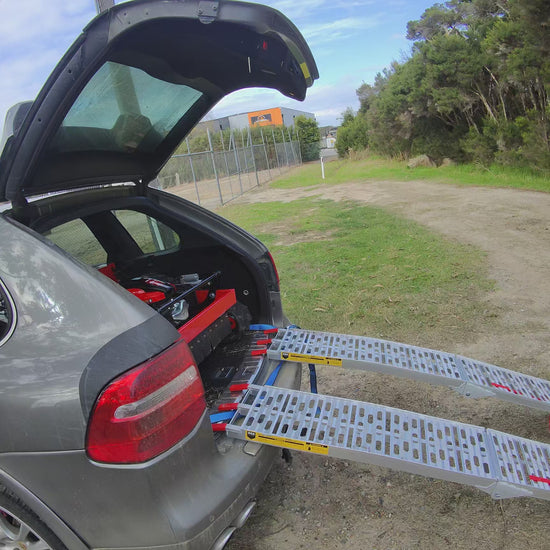 Typhoon remote control mower unloading from the back of my car. Easy to move without a trailer. Loads and unloads without the motor running www.rebelmowers.com.au