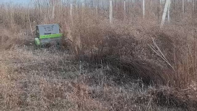 Remote Control Mower Big Boar 1200mm cut Heavy Duty all terrain flail mower cutting long grass. The flail design gives the blades easy access to the vegetation allowing overgrown land to be reclaimed easily.